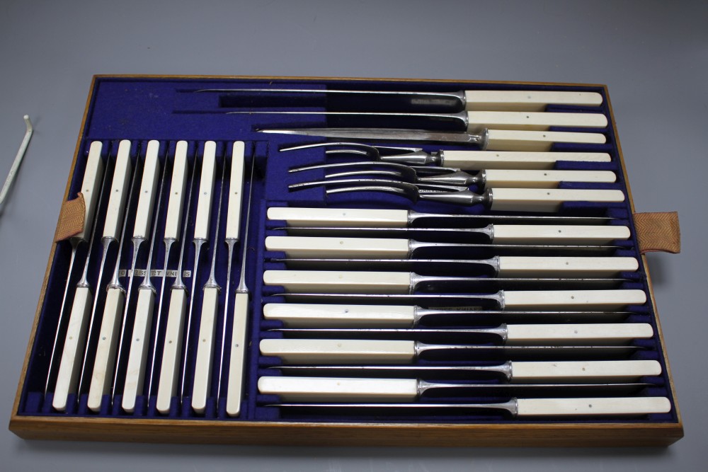 A W H Benson canteen of plated Old English pattern flatware for twelve people, in three tier golden oak case, with ivory handled knives
